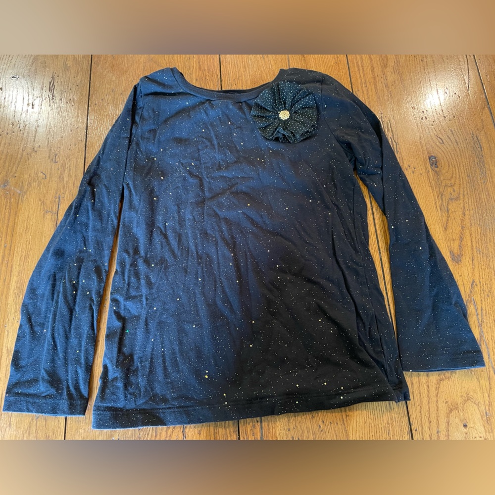 Carter’s Kid black with gold sparkles and flower shirt size 7